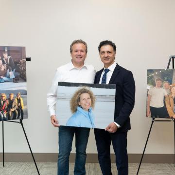 Tom Hanchette and Dr. Behnam Badie with images of Bridget Hanchette